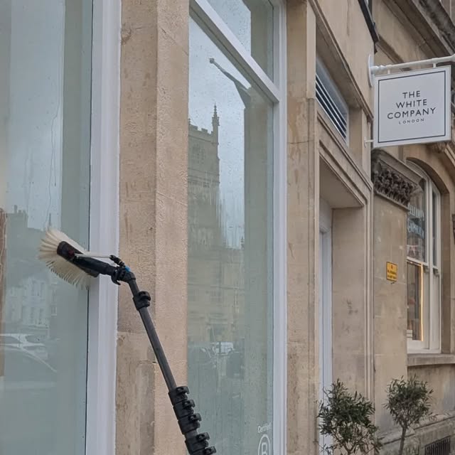 Water-fed pole cleaning The White Company shopfront in Cirencester